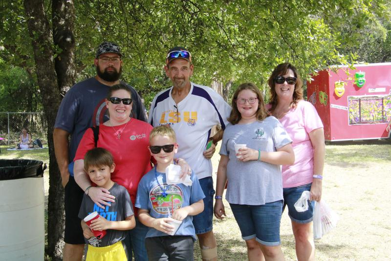 Family enjoying gumbo samples at the festival